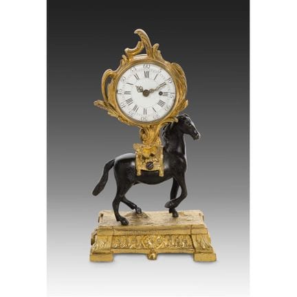 Orologio in bronzo dorato e bronzo patinato in sti