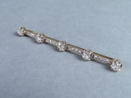 Elégante broche barrette, la monture en or jaune (