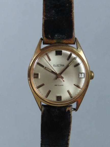 ELECTRA, France. Wristwatch with a circular gold-p