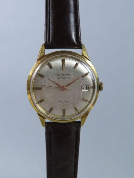 DUGENA, Germany. Tropica. Circular gold-plated met