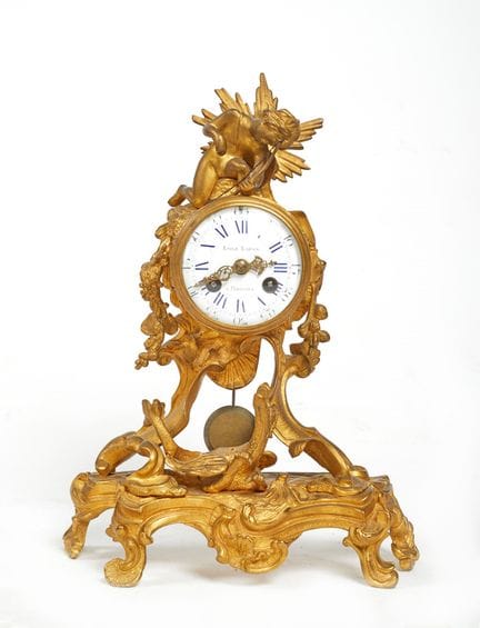 Clock    32x24x10 cm
Rocaille-style table clock in