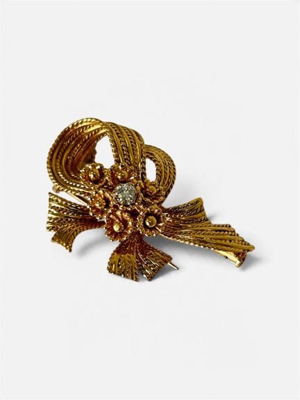 Broche en or jaune 750/°° (18 cts) formant fleurs 