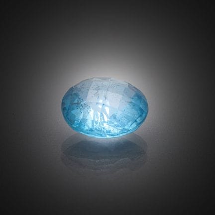 Topaze bleu ronde sur papier.
Poids : 3,82 cts.