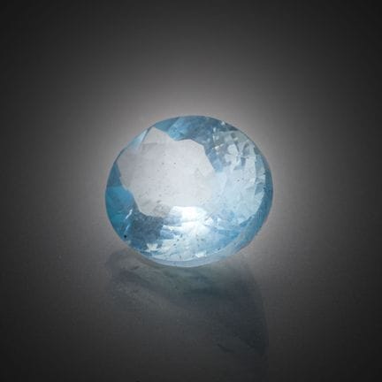 Aigue-marine ronde sur papier. 
Poids : 1,24 ct