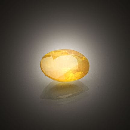 Oval yellow sapphire on paper.
Weight: 2.07 cts.
D