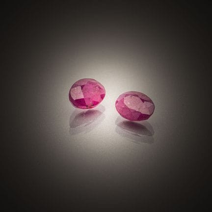 Pair of oval rubies on paper. 
Weight: 2.29 cts.