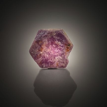 Raw ruby on paper.
Weight: 102.76 carats.
Dimensio