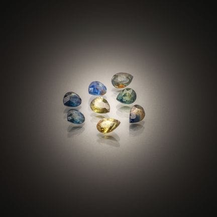 Set of eight blue/green pear-shaped sapphires on p