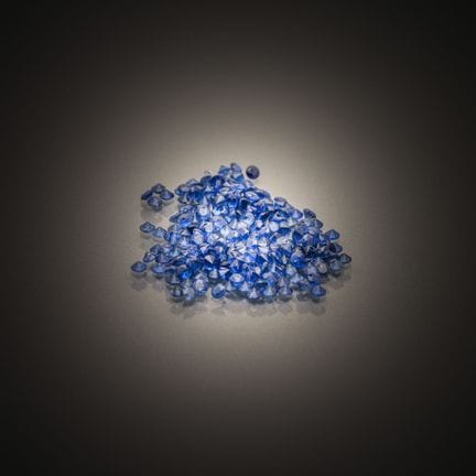 Lot of round sapphires on paper.
Approximately 240