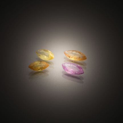 Set of four pink and yellow marquise-cut sapphires