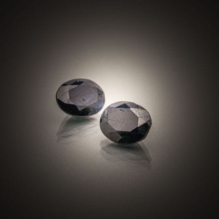 Pair of oval sapphires on paper. 
Weight: 4.90 cts