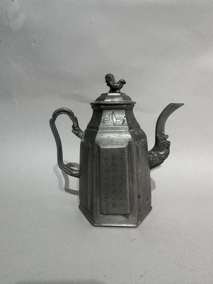 CHINA
Pewter teapot with a Fo dog design on the li