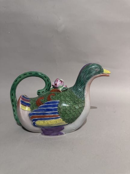 CHINA
Polychrome glazed porcelain pitcher with a d
