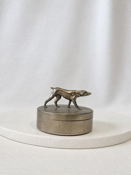 CHRISTIAN DIOR
Circular box with a silver plated m