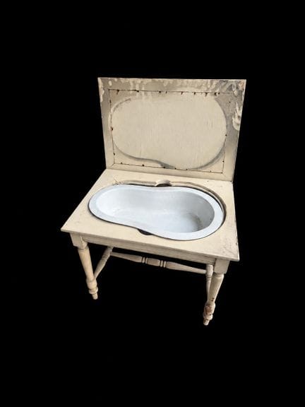 Lacquered wooden bench with a cane seat, featuring