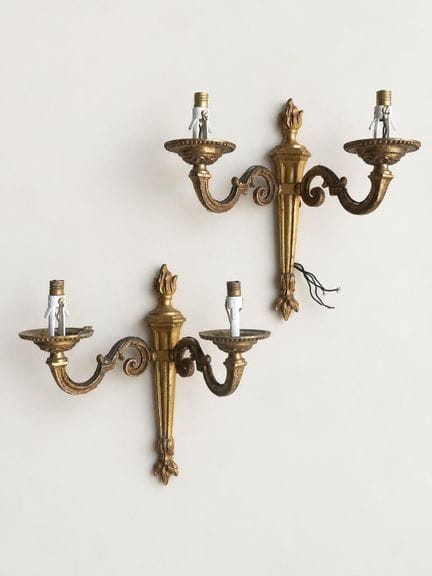 Pair of Louis XVI-style wall sconces in gilded bro