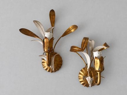 Pair of asymmetrical wall sconces made of gold-pla