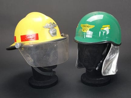 South Korea, set of two firefighter helmets. A yel