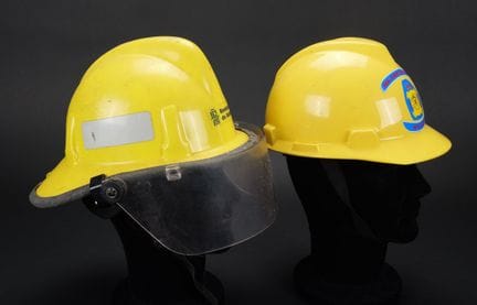 Spain, set of two firefighter helmets. Two yellow 