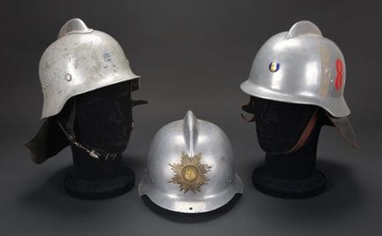 Finland, set of three firefighter helmets. Crested