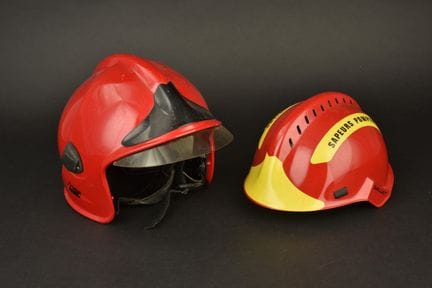 France, set of two red Gallet firefighter helmets.