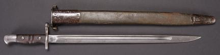 British 1907 bayonet. Metal fittings. Brown wooden
