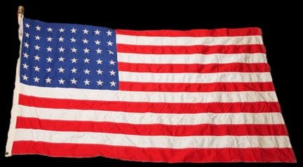 U.S. flag in its original box. Complete wooden fla
