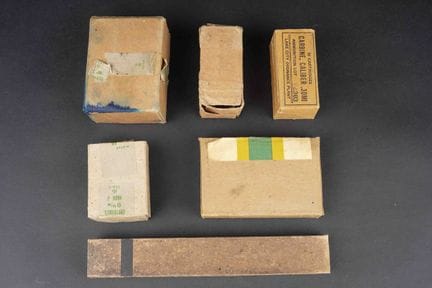 Boxes for U.S. ammunition. Empty. Includes a cardb