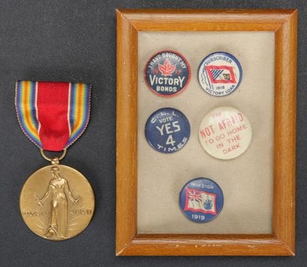 Small U.S. insignia. Includes a badge reading “I h