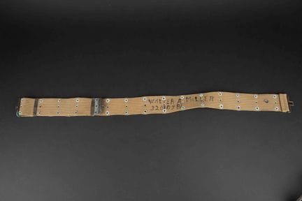 M1936 named pistol belt. Made of heavy OD webbing.