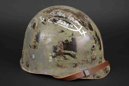Replica of a paratrooper's helmet signed by the ca