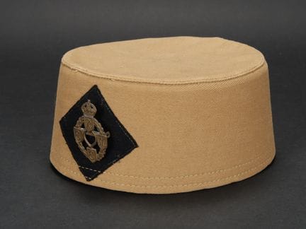 REME fez. Made of thick beige fabric. Machine-sewn