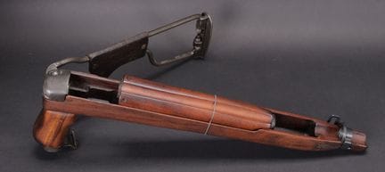 USM1A1 folding rifle stock. Wooden frame, marked “