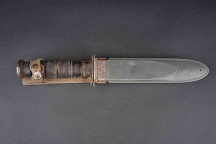 USN MK 2 knife. The metal fittings show signs of o