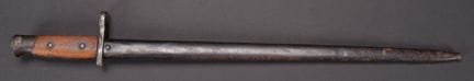 British 1918 bayonet. Wooden grip panels. The pres