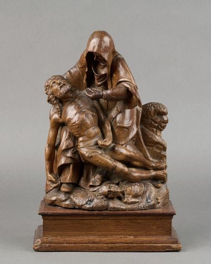 "VIRGIN OF MERCY," carved from oak, resting on a r