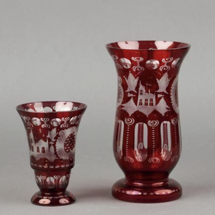 Two red overlay Bohemian crystal vases decorated w