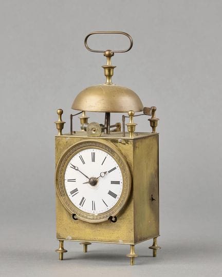 Brass "capucine" clock, with an enameled dial feat