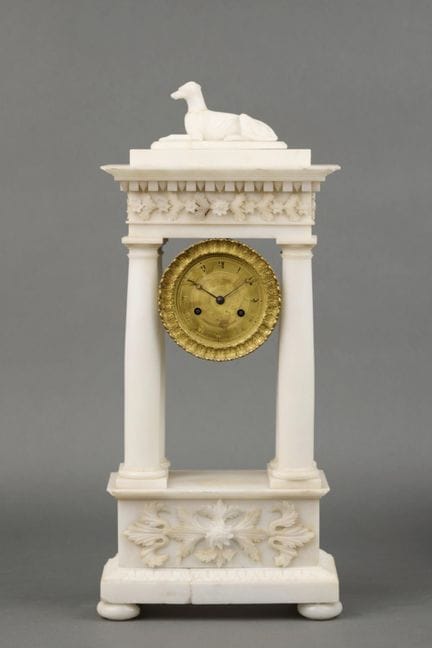 A large alabaster PORCH CLOCK with bas-relief deco