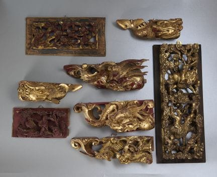 Eight Chinese wooden reliefs, some in the shape of