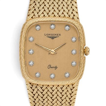 Montre Longines en or jaune 14 carats et diamants,