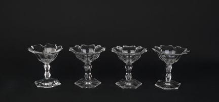 Set of four crystal salt cellars on stands
The flo