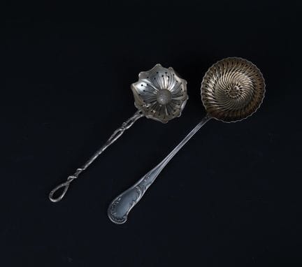 Set of two 950°/00 silver sprinkling or fruit spoo