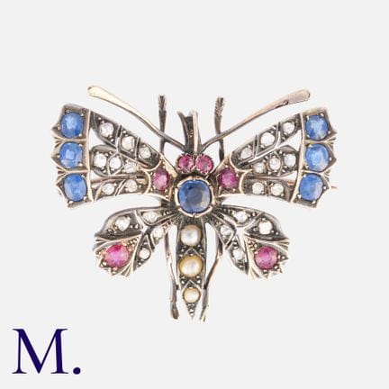 Une broche ancienne en or jaune et argent, ornée d
