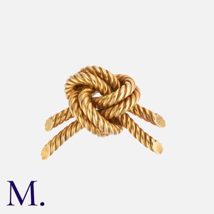 HERMÈS. Broche-barrette « Gold Knot » en or jaune 