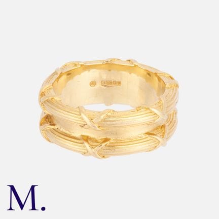 THEO FENNEL, une alliance en or jaune 18 carats, a