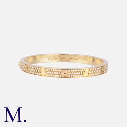 CARTIER. Bracelet « Love » en or 18 carats, serti 