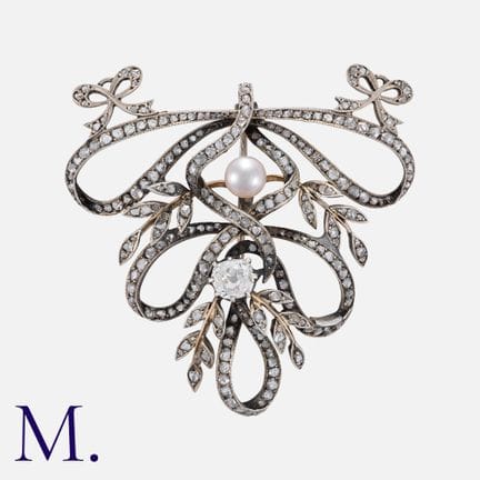 Broche en or jaune et argent, ornée de perles et d
