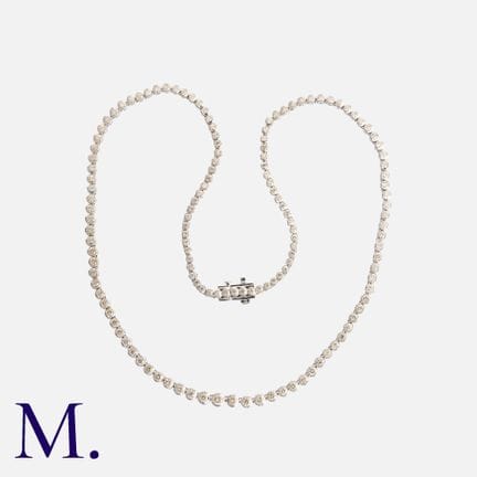 Collier en or blanc serti de diamants ronds taille