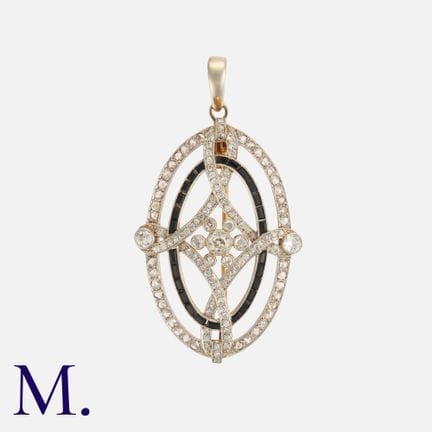 Une broche-pendentif Art déco en or jaune 18 carat
